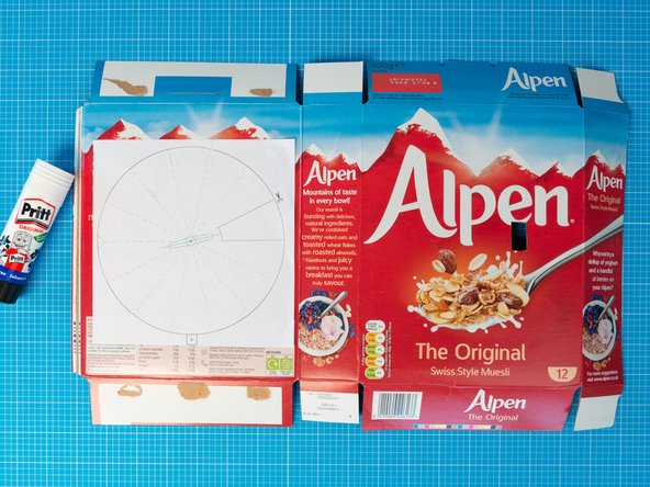 Turn the box so that  the cereal graphics are facing towards you. You will be working now on what will be the inside of the box.