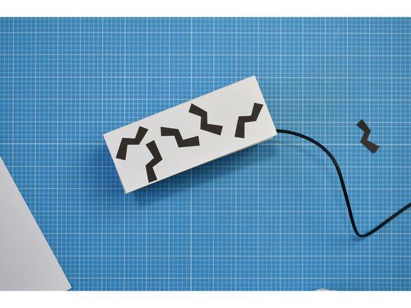 Cut out the 'noise' graphics and stick to the box in any arrangement you wish.