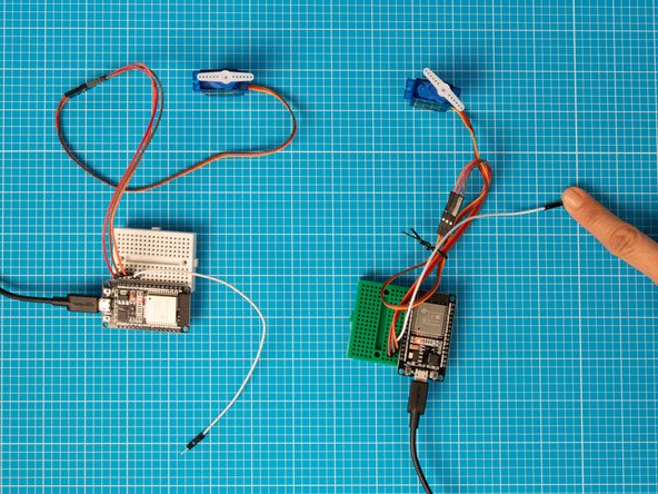 Tap on either device's capacitive touch lead to advance both servo motor positions. Make sure to test them both.