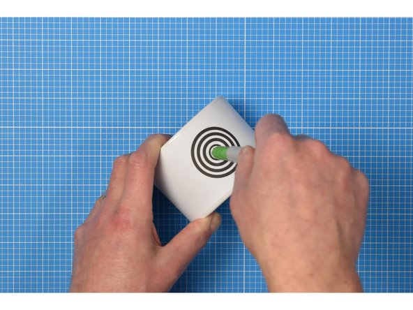 Gently enlarge the hole again using a marker pen such as a Sharpie.