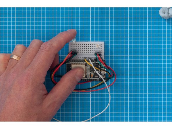 The breadboard will be mounted upright inside the container, so we need to bend the LED's as shown in the image so that they will face the lid.