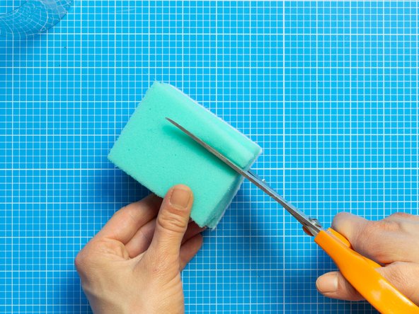 Cut the sponge into little squares of around 1 cm each.