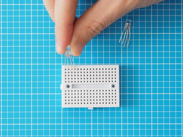 Place LEDs in breadboard as pictured. Make sure the orientation of the LEDs are the same (short legs to the left of the breadboard)