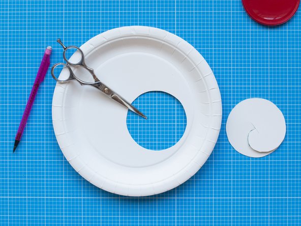 Cut the circle with scissors or a scalpel.