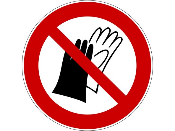 Gloves or loose clothing could be pulled into the moving blade resulting in serious injury.