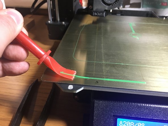 Use the spatula to remove any remnants of filament on the build platform (don't make the next user clean up after you!)