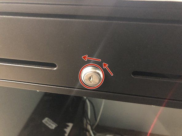 Turn the key fully to the left (counter-clockwise) to open the drawer