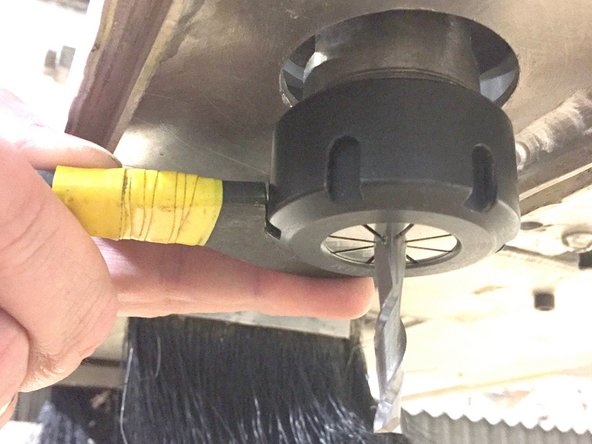 If performing a tool change, remove the existing bit, collet and collet nut from the spindle.