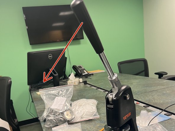 Pull the handle of the machine down until the mold halves close completely.