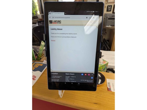 Power the iPad on with the power button located on the bottom left.