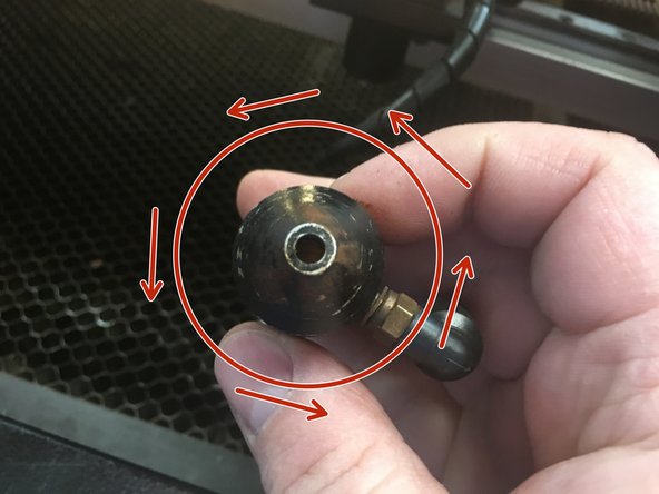 The air nozzle portion of the lens tube is threaded onto the tube body.  Turn the nozzle counter-clockwise to remove it.