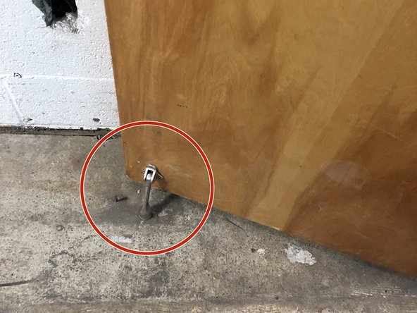 There is a door stop attached to the door.