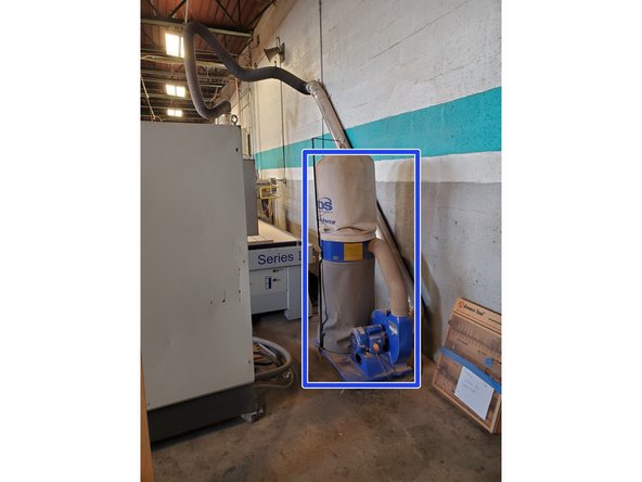 The dust collector is behind the main control panel.