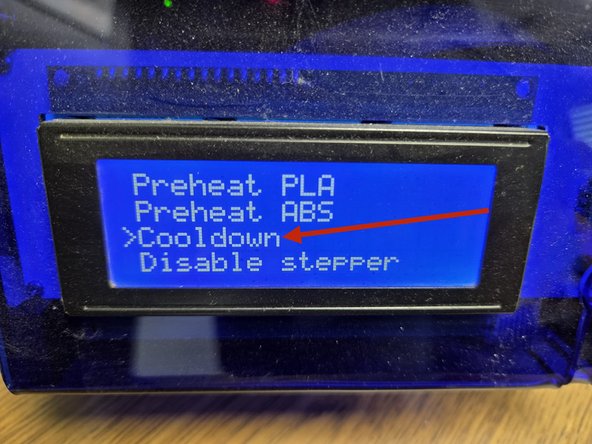 Before powering off the printer, press the control Knob and rotate it until printer settings is selected, then continue to rotate the control knob until cool down is selected.