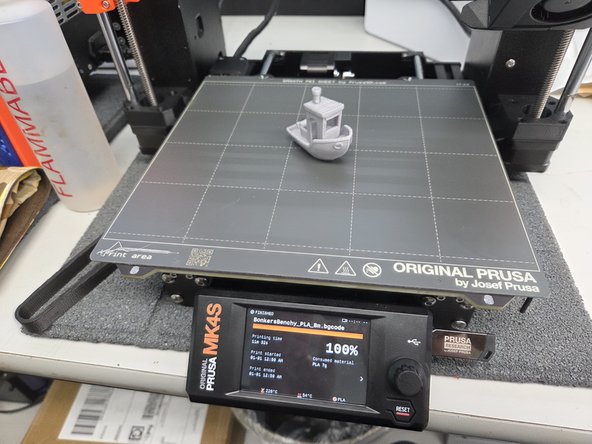 The 3D printer will automatically start printing when it reaches the correct temperature, by cleaning its nozzle and tapping the build plate in several areas to automatically level itself