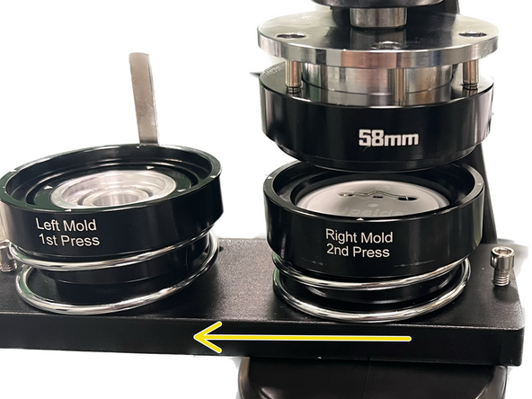 Slide the tray to the left to align it with the right-hand mold.