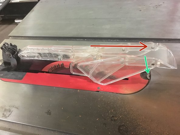 Rotate the plastic guard down.