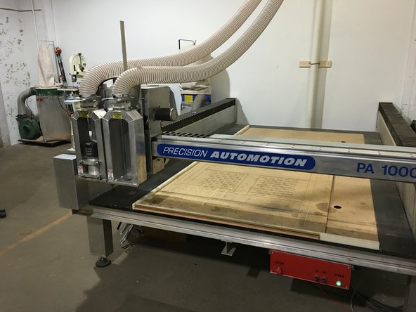 Ensure that the machine bed is fully clear.