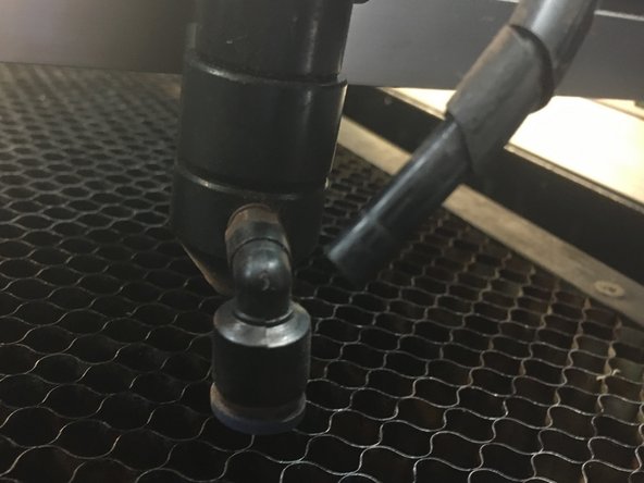 Press down on the blue retaining ring.