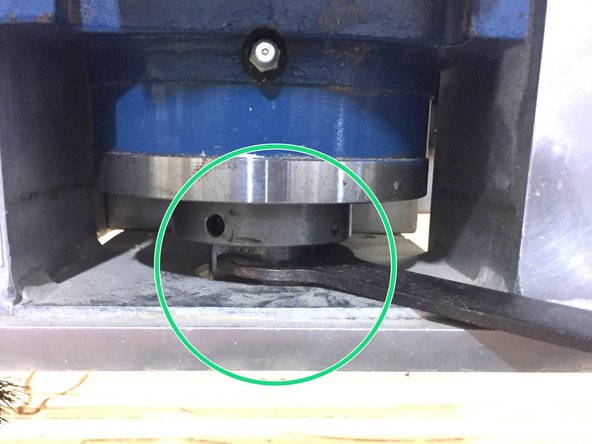 Place the top spindle wrench onto the flats on the spindle to stop the spindle from rotating while you install the collet.