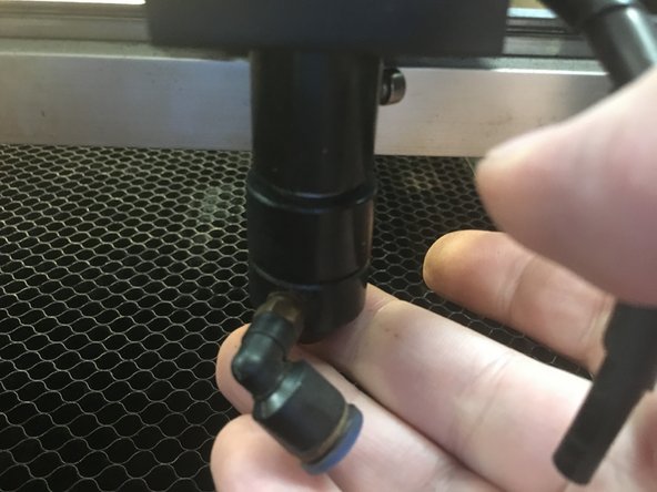 Place a hand under the lens tube.  As you loosen the screw the lens tube will drop out of the mirror assembly.