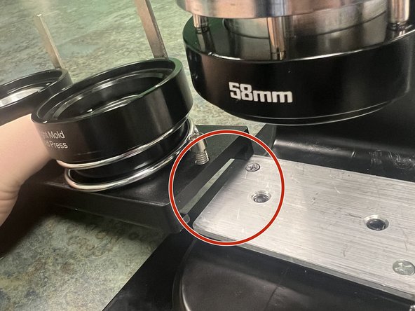 Align the tray dovetail with the matching plate on the press.