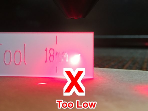 Do not hold the focus tool under the lens while moving the bed up and down.  This could cause the focus tool to jam and affect the alignment of the machine.