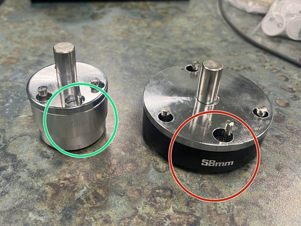 The smaller of the two top molds is used to press 25mm diameter buttons.