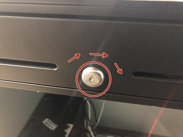 Turn the key in the lock fully to the right (clockwise) until the key is vertical.