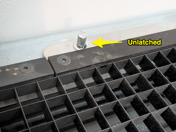 Locate the small knob latches in the four corners of the screen and push down firmly. These spring loaded latches should be taller after.