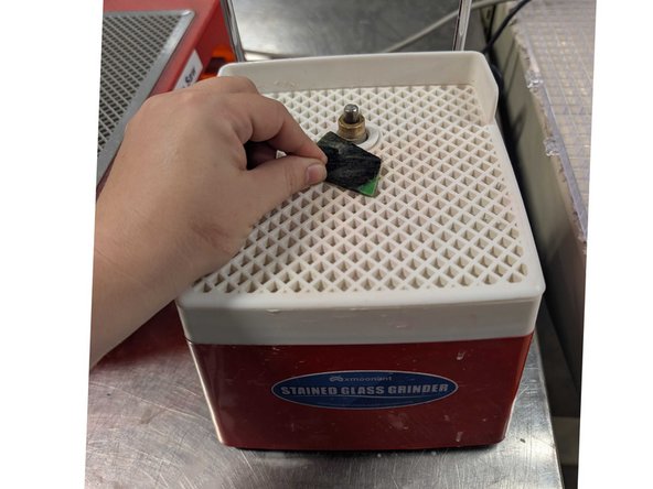 Using the grinder, you can smooth sharp edges on your glass pieces as well refine the shapes and how pieces fit together. A nicely ground edge also holds the copper foil more nicely in the next step.