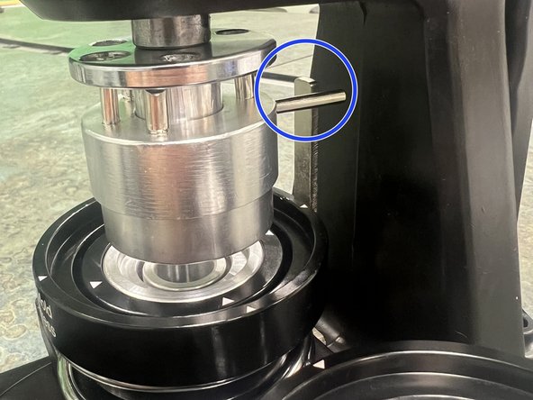 Remove or loosen the screw at one end of the sliding tray.