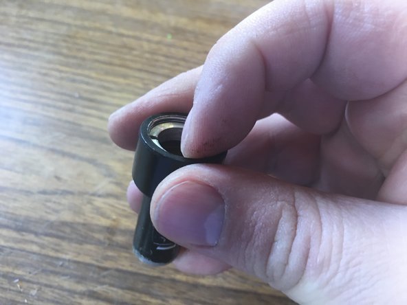 Tighten the lens retaining ring by hand.