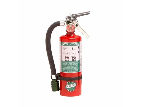 Lift the lid of the machine:  This will stop the laser cutter, and the disruption of airflow is often enough to put out the flame.