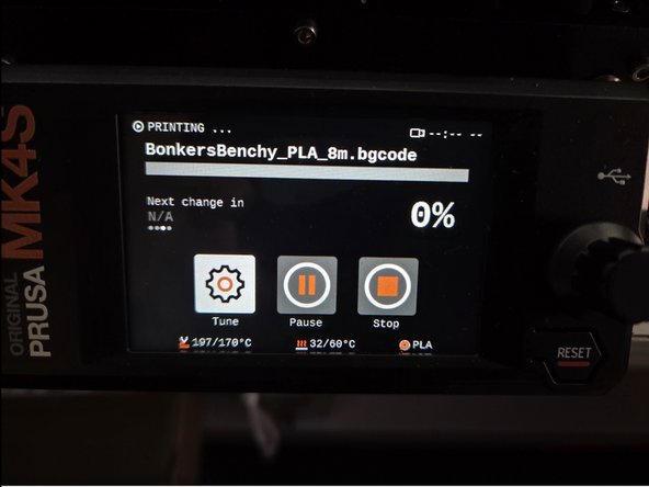 The 3D printer will display a screen like the first image, which displays information about the print. Most importantly how far along the print is displayed as a percentage.