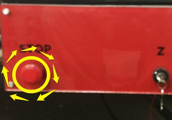 Rotate the STOP switch 1/4 turn clockwise.