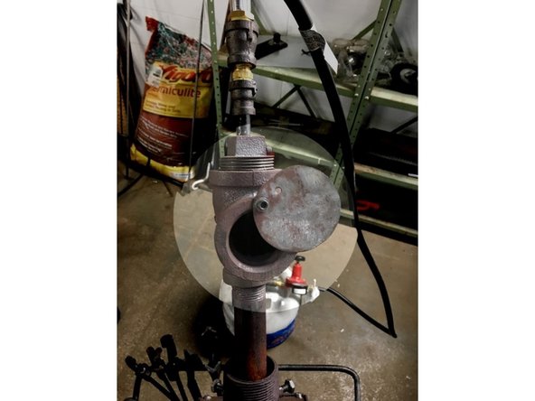 After a couple of minutes once the inside surfaces of the forge are becoming incandescent, open the choke plate until the air intake is 1/4 covered.