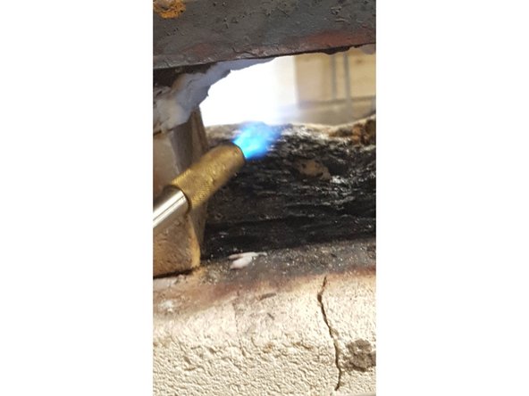 Hold unlit Propane, Mapp Gas or Butane nozzle in the front forge opening.