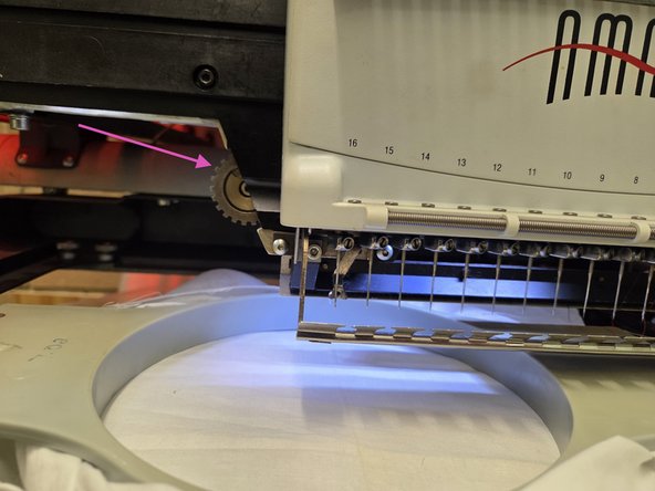 Then by going to tools, maintenance, then the head timing tab, then clicking bottom center. With the needle in the lowest position rotating the gear clock wise raises the presser foot. It should be adjusted to just above the hooped fabric
