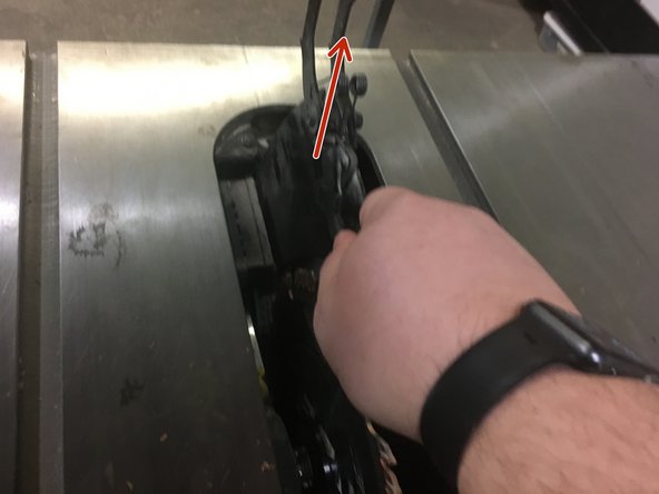 Lift the metal blade guard to remove it from the machine.