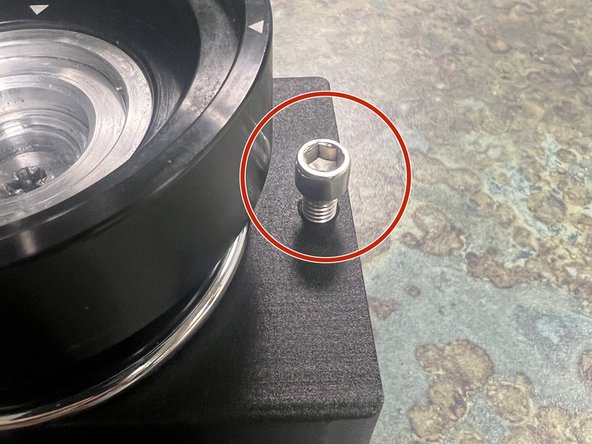 Reinstall the screw that keeps the tray from sliding off. (This isn’t strictly necessary, but do us a solid here)