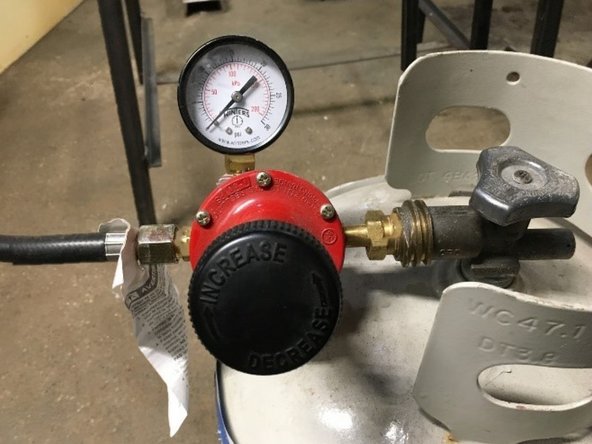 Check propane regulator gauge. Turn regulator knob clockwise until the regulator gauge reads 8 psi.