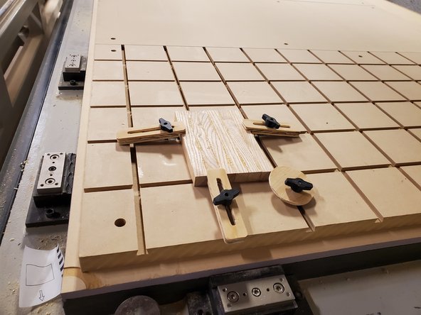 Rearrange the top spoil board panels if necessary.