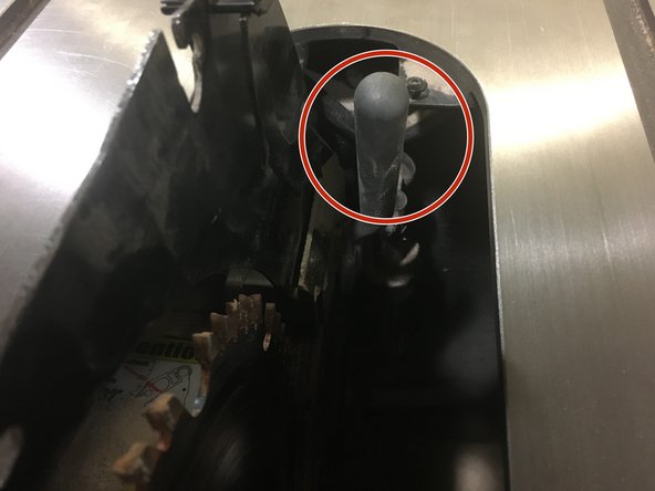 Rotate the locking lever down and toward the back of the machine.