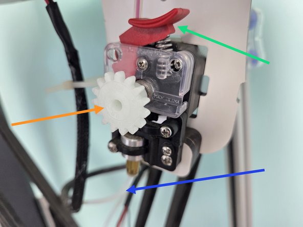 To continue to feed filament hold down the tension lever, like the second image, and keep feeding filament until its past the tension lever.