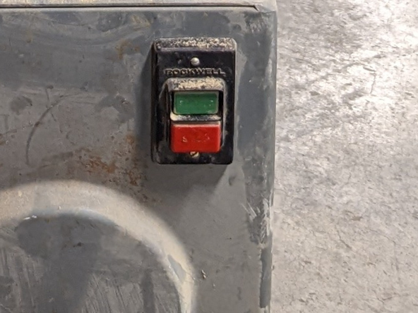 Press the stop button to turn off the saw.