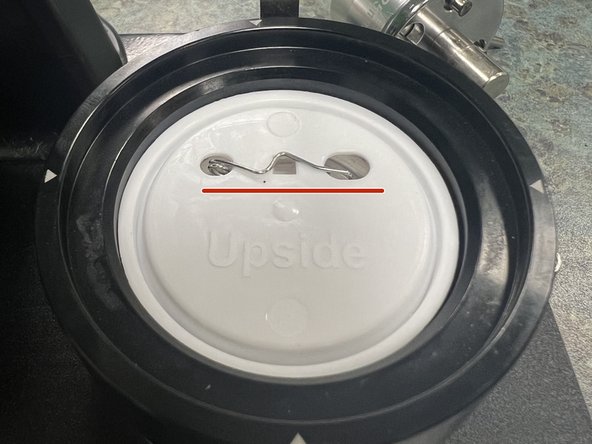 Insert the appropriate button back, PIN SIDE DOWN into the right-hand mold.