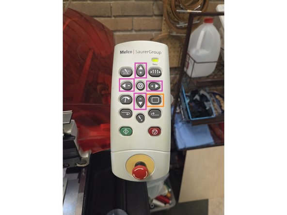 The position of the design can be adjusted using the control panel, visible in the second image, on the side of the machine. Pressing and holding the hoop button while also pressing the arrow buttons moves the design and hoop.