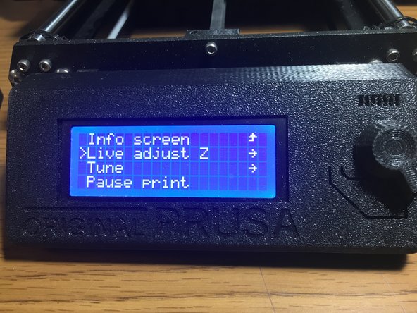 Watch the first layer to be sure that it has a smooth appearance and is sticking to the bed well. The layer should appear slightly smooshed to the bed, but not so much that they have gaps (too low) or appear rounded or don't stick to the bed. (too high)