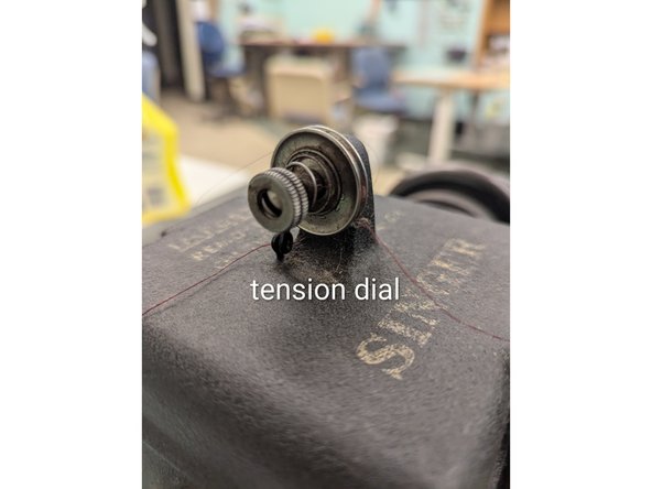 Tension is adjusted by turning the dial on the tension disks.